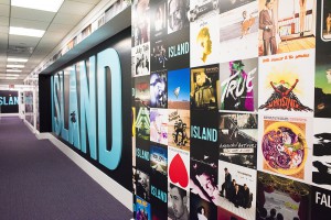 Island Records Name on wall with mural of album covers 