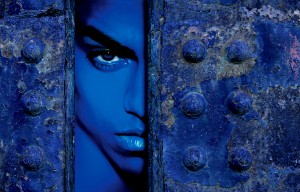 Drew Tal Worlds Apart Blue Man looking through door