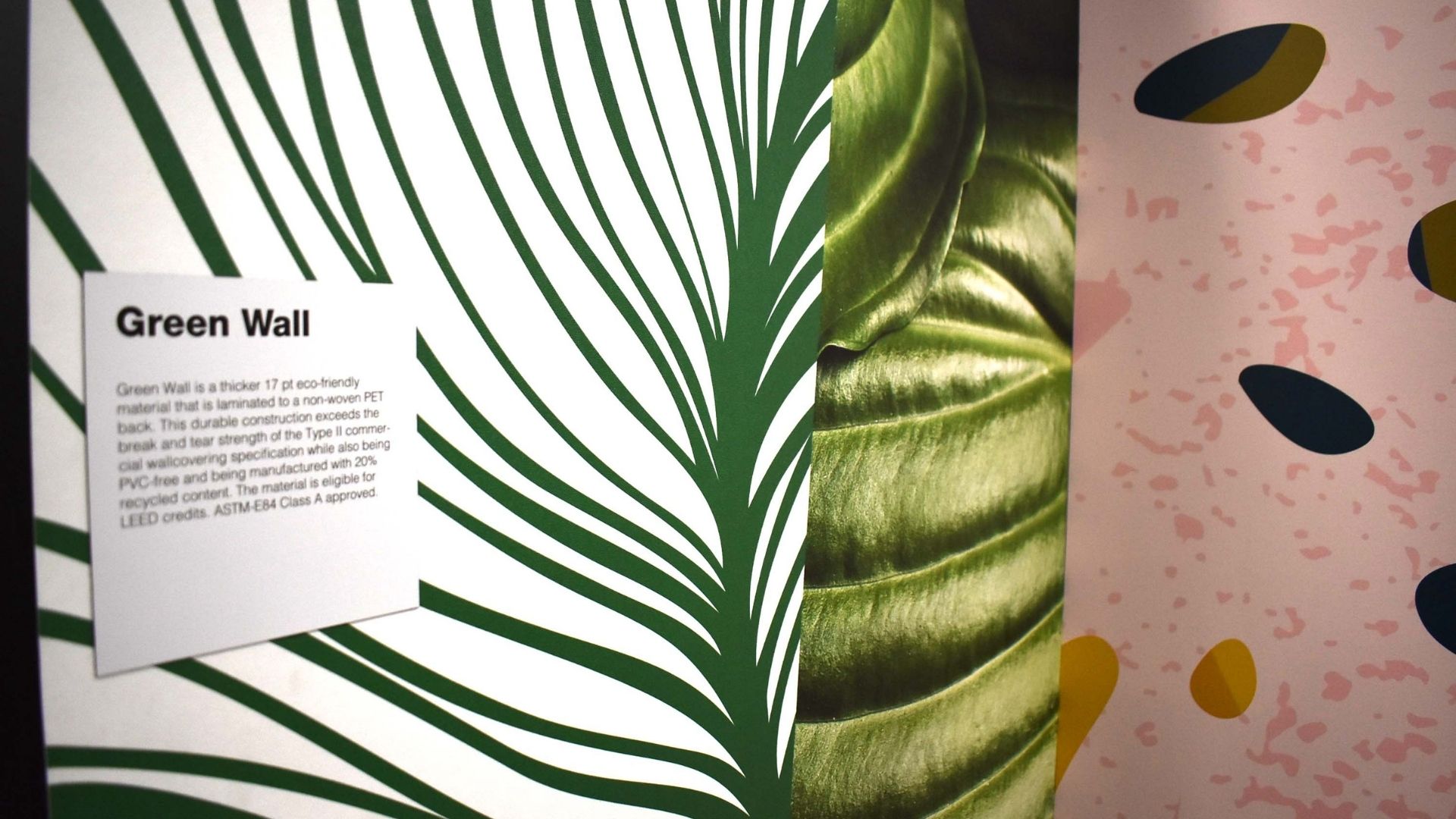 Photo of a close up of a wallpaper featuring a green veiny leaf illustration
